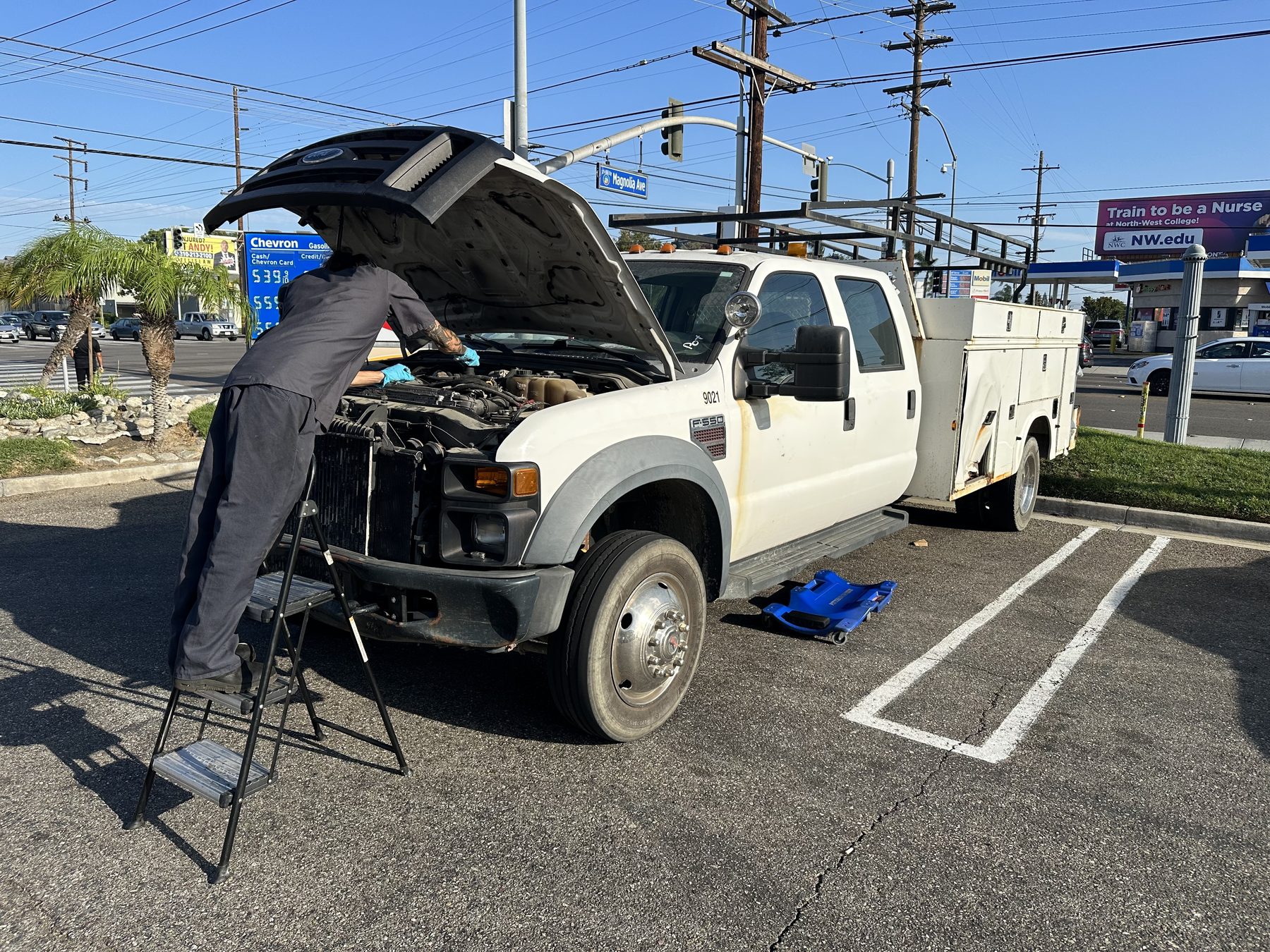 A1Mobil mechanic servicing a diesel utility truck on location